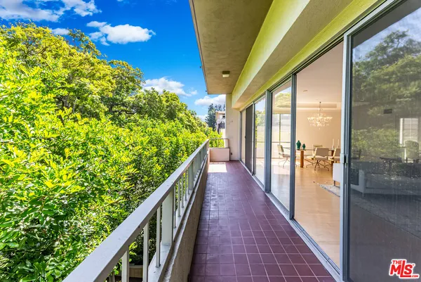 a view of balcony and yard