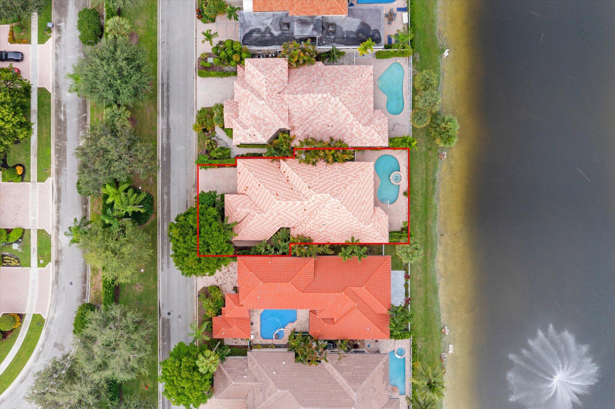7081 Mallorca Crescent Boca Raton, FL 33433 - Photo 23 of 26 an aerial view of a house with a yard and tennis court