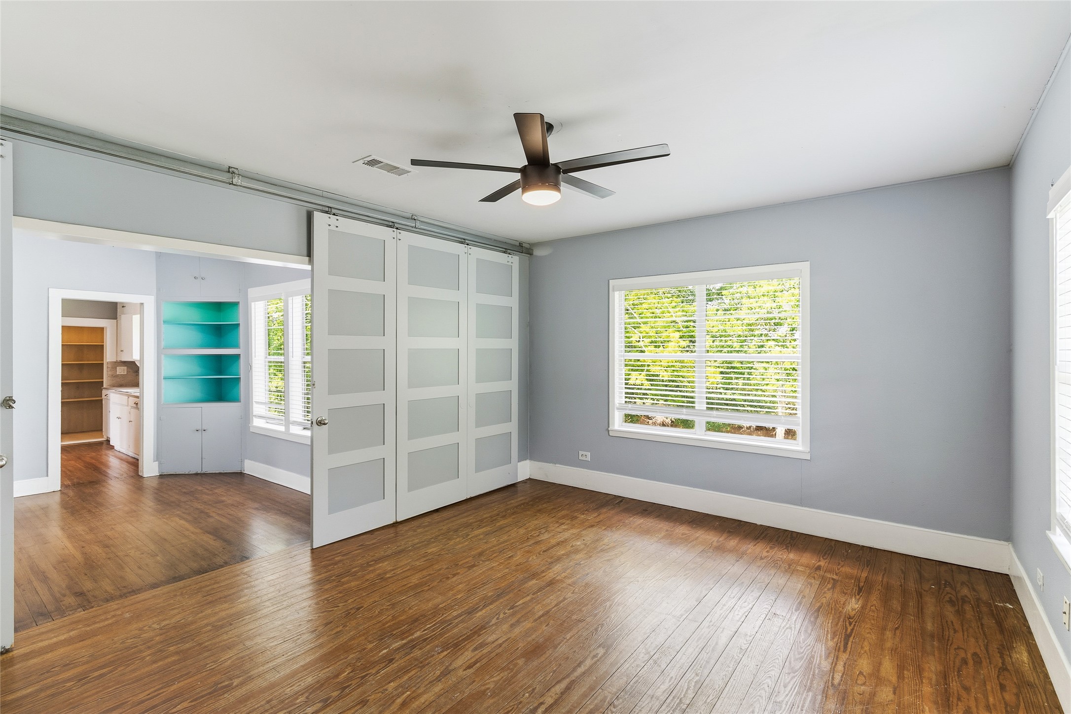 12903 Sandpiper Road Angleton, TX 77515 - Photo 11 of 19 Sliding barn doors provide the option to create privacy or keep the room connected to the main living areas, making it easy to adapt the space to your needs.