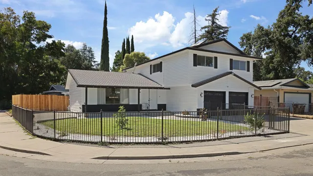 a view of a house in front of a yard