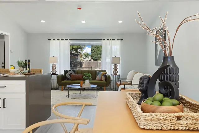 a large kitchen with stainless steel appliances granite countertop a lot of counter space and a sink