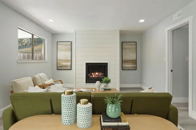 a white toilet sitting in a bathroom next to a sink