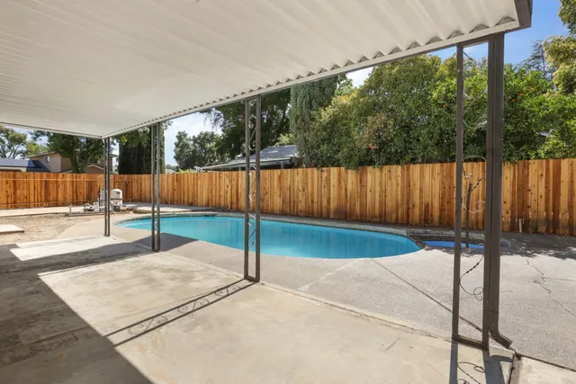 a view of a house with swimming pool