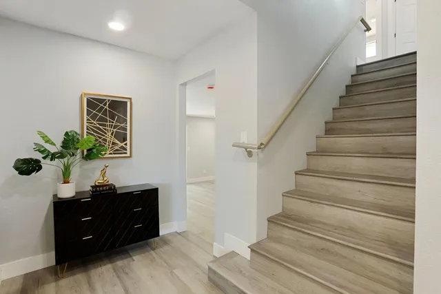 a living room with furniture and a lamp