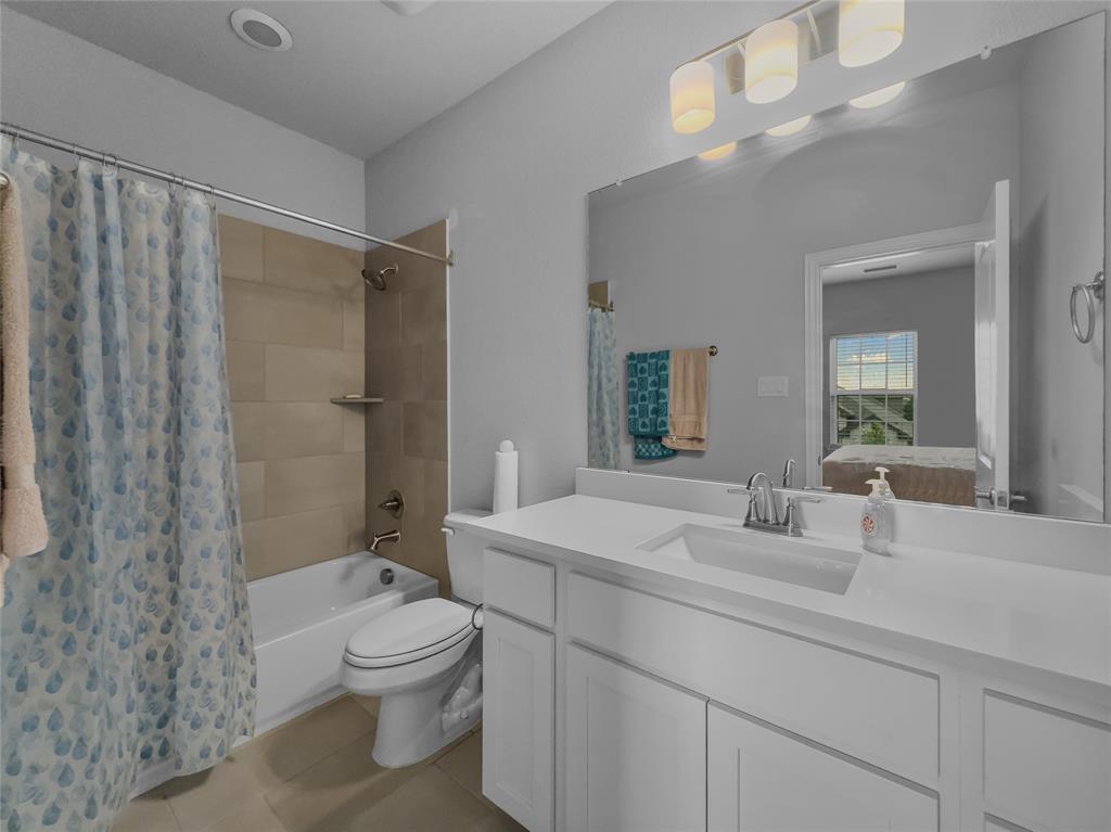 116 Chaco Drive Forney, TX 75126 - Photo 25 of 27 a bathroom with a sink a toilet and shower