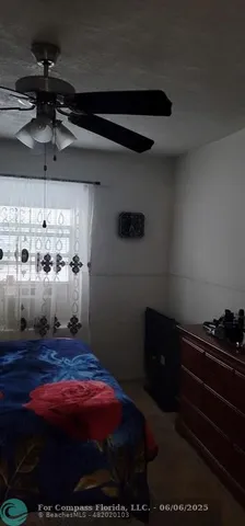 a kitchen with a sink a stove and chairs