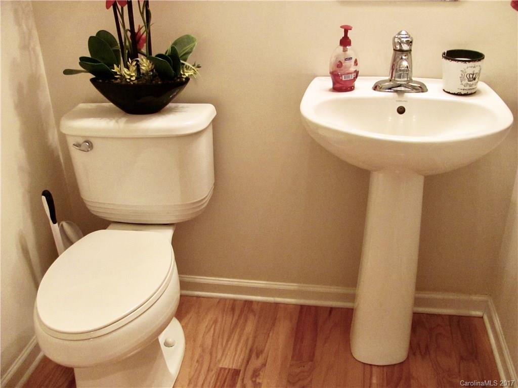 1068 Drayton Court, Unit 100 Fort Mill, SC 29708 - Photo 12 of 15 a bathroom with a toilet sink and mirror