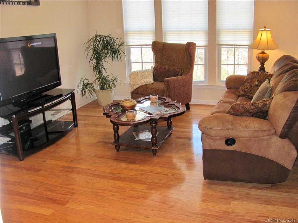1068 Drayton Court, Unit 100 Fort Mill, SC 29708 - Photo 4 of 15 a living room with furniture and a flat screen tv