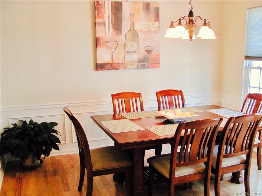 1068 Drayton Court, Unit 100 Fort Mill, SC 29708 - Photo 5 of 15 a dining room with a table and chairs
