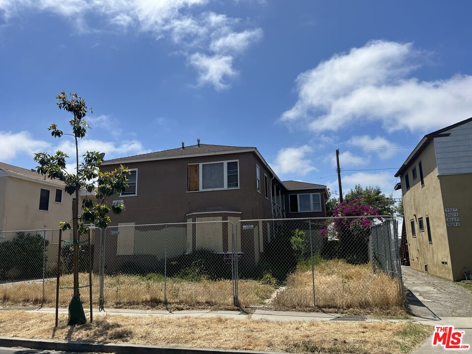9033 Ramsgate Avenue Los Angeles, CA 90045 - Photo 1 of 2 a front view of a house with a yard