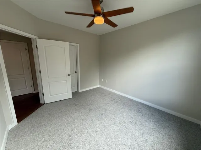 an empty room with mirror gate