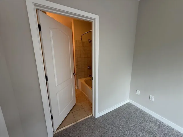 a bathroom with a sink a mirror and a shower