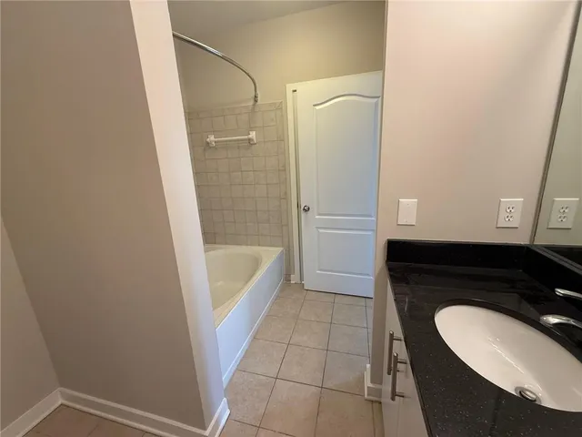 a bathroom with a bathtub and shower