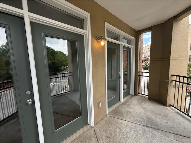 a vase of flowers sitting on a wall