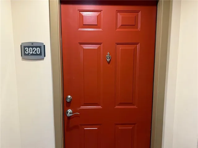 a kitchen with appliances a sink and cabinets