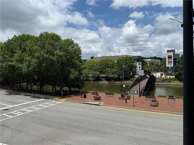 a bathroom with a sink a toilet a mirror and shower