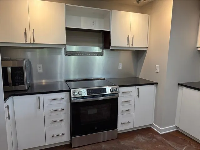 a close view of cabinets and wooden floor