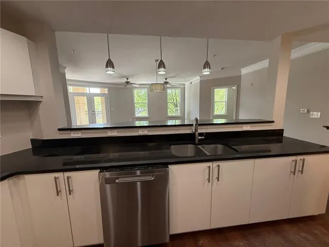 a kitchen with a refrigerator and a sink