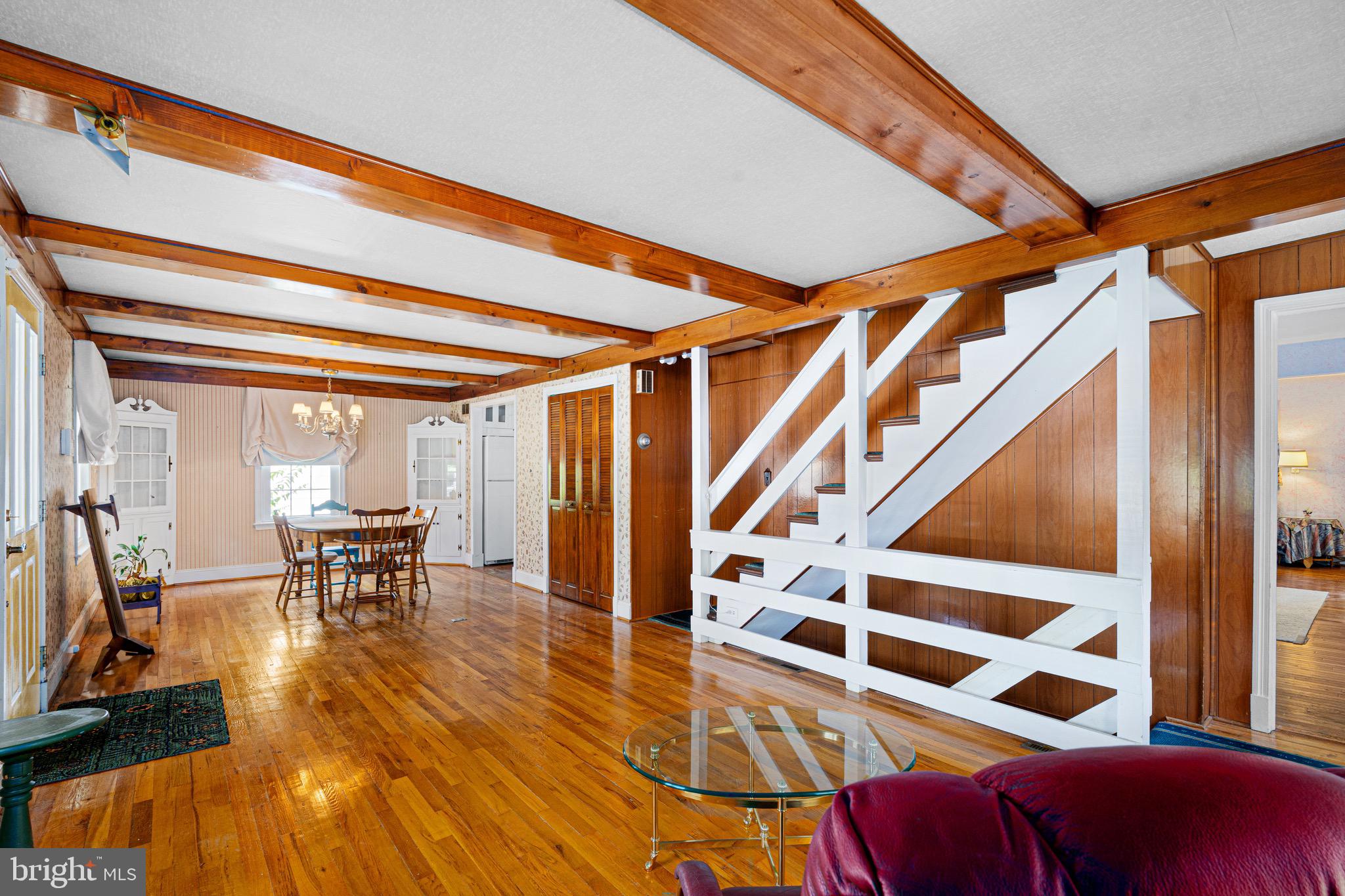 2605 Taney Road Baltimore, MD 21209 - Photo 5 of 35 a dining room with wooden floor table and chairs