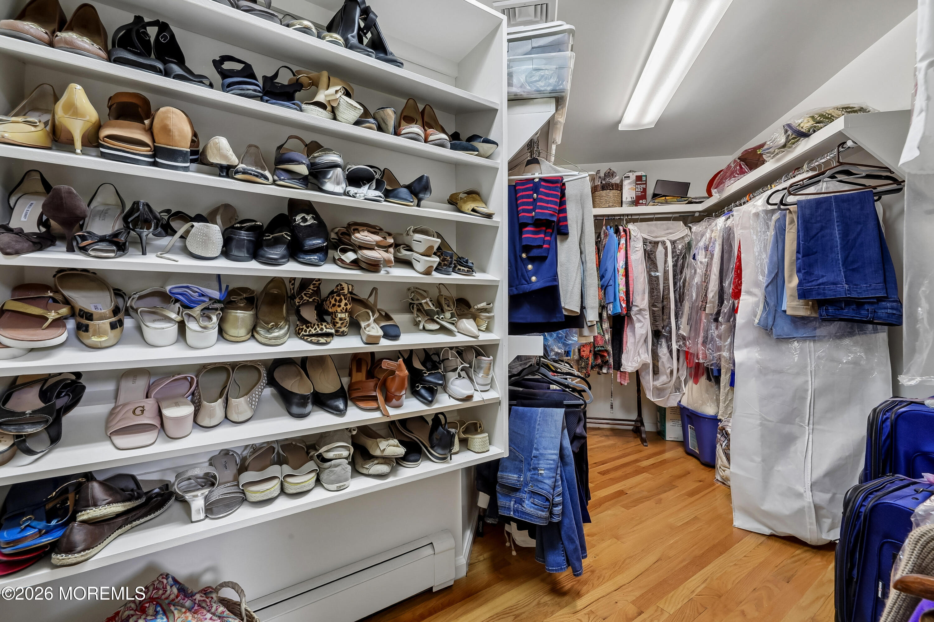 187 Hockhockson Road Colts Neck, NJ 07722 - Photo 31 of 55 a view of walk in closet with clothes and shoes