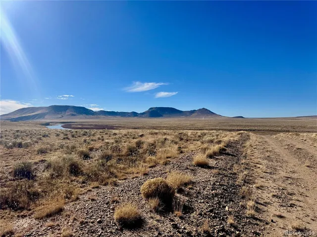 a view of yard and mountain