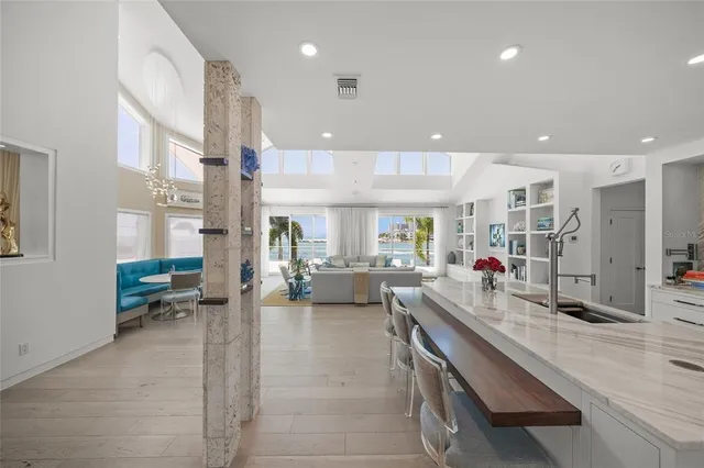 a view of a dining room with furniture and chandelier