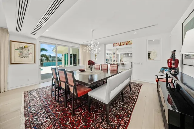 a view of a hallway view with living room and dining room view