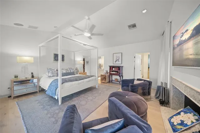 a bathroom with a sink mirror and toilet