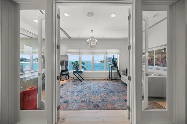 a bedroom with a bed couch and a window