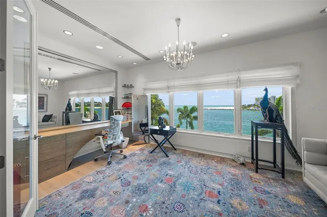 a view of a hallway with wooden floor and stairs