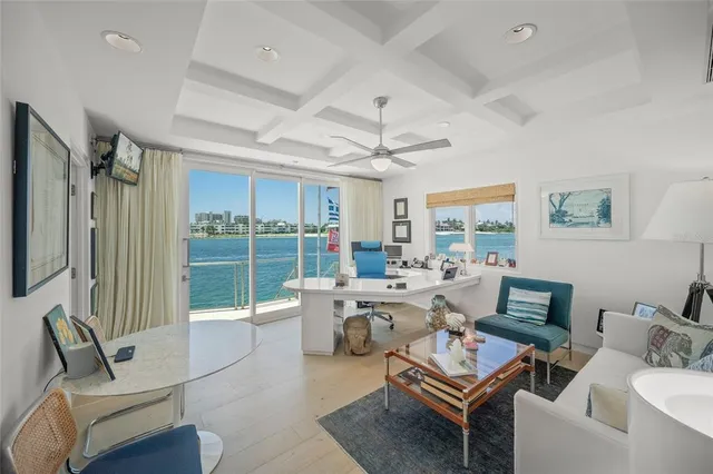 a bed room with a bed mirror and a window