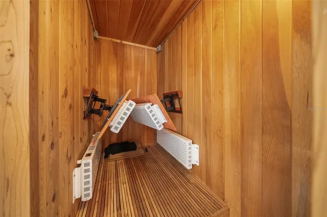 a view of staircase with railing and a chandelier