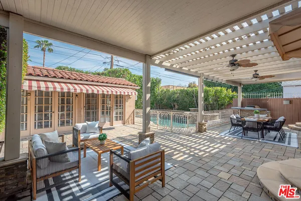 a view of a swimming pool with a patio