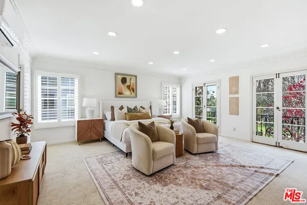 a living room with furniture and windows