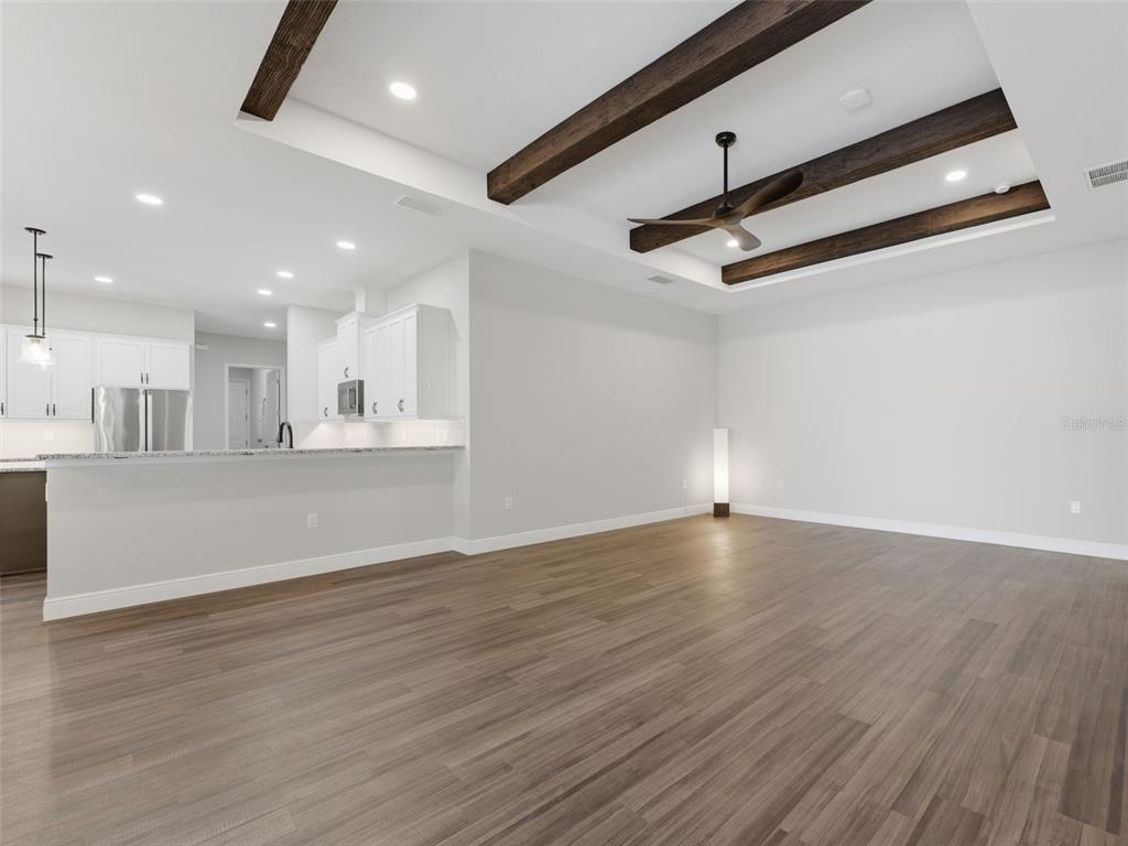 4025 Spring Park Way Brooksville, FL 34604 - Photo 22 of 97 a view of a kitchen with wooden floor and a sink