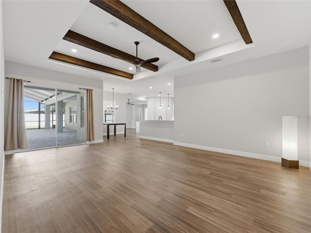 4025 Spring Park Way Brooksville, FL 34604 - Photo 28 of 97 a view of an empty room with wooden floor and a window