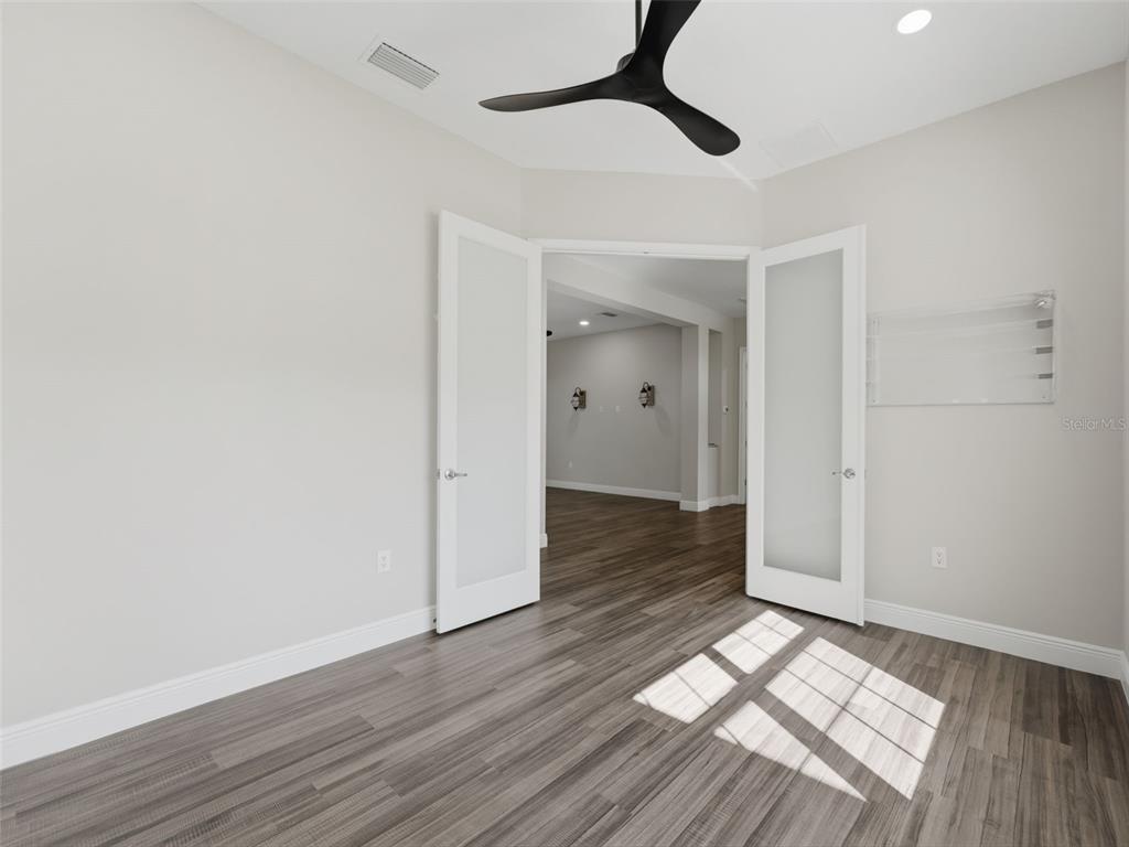 4025 Spring Park Way Brooksville, FL 34604 - Photo 48 of 97 a view of empty room with wooden floor