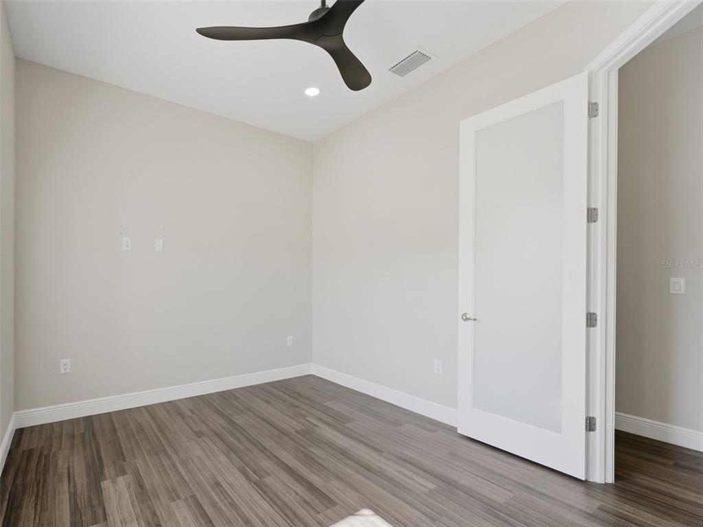 4025 Spring Park Way Brooksville, FL 34604 - Photo 50 of 97 a view of an empty room with wooden floor