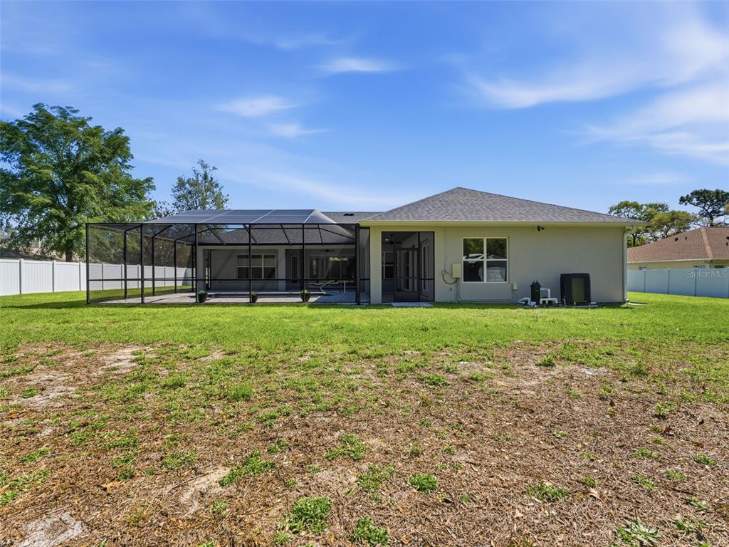 4025 Spring Park Way Brooksville, FL 34604 - Photo 85 of 97 a front view of house with yard