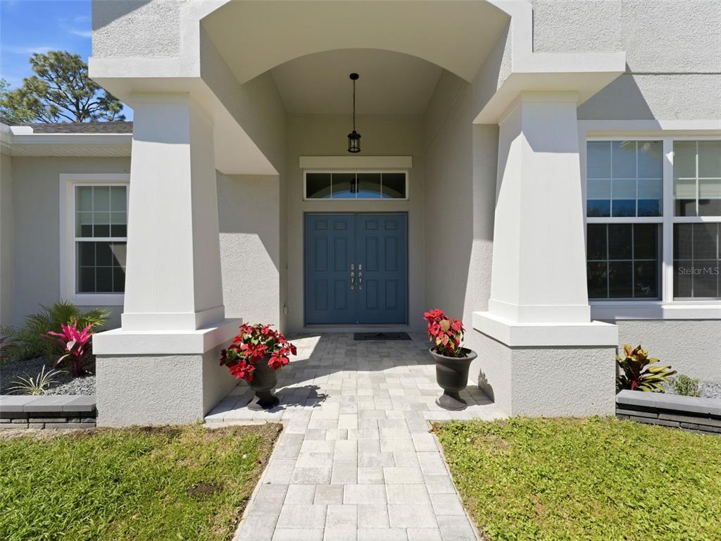 4025 Spring Park Way Brooksville, FL 34604 - Photo 9 of 97 a front view of a house with outdoor seating