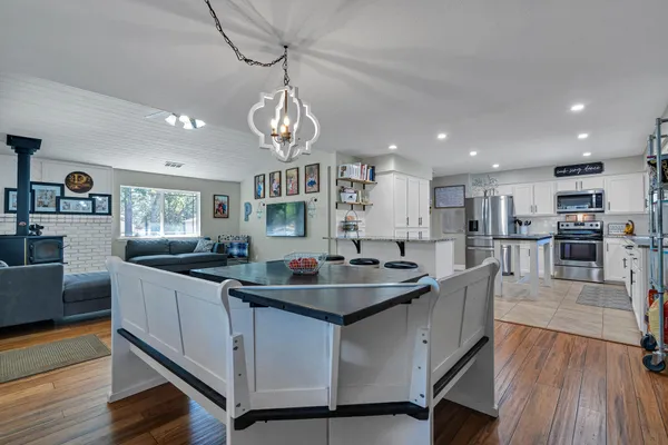 a kitchen with stainless steel appliances granite countertop a refrigerator sink and cabinets