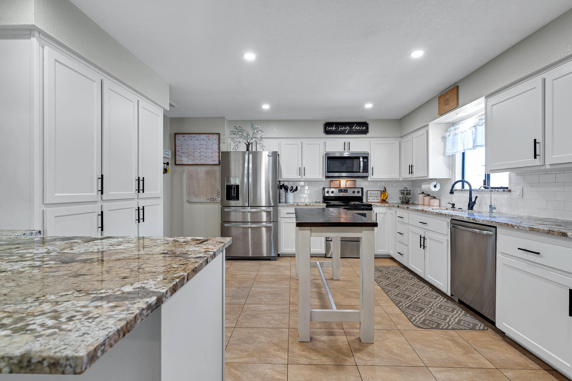 23570 Cassel Fall River Road Fall River Mills, CA 96028 - Photo 20 of 73 a kitchen with stainless steel appliances granite countertop a refrigerator sink and cabinets