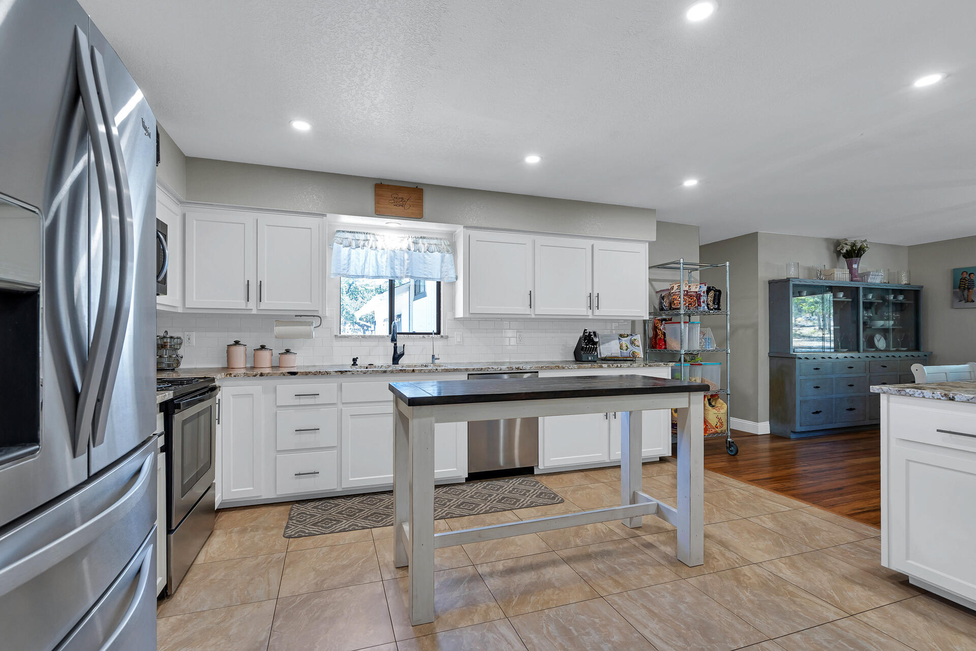 23570 Cassel Fall River Road Fall River Mills, CA 96028 - Photo 22 of 73 a kitchen with stainless steel appliances granite countertop a refrigerator and a sink