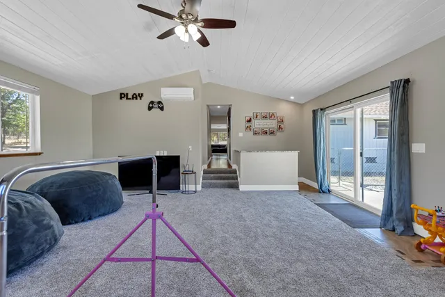 a bed room with a bed and a chandelier