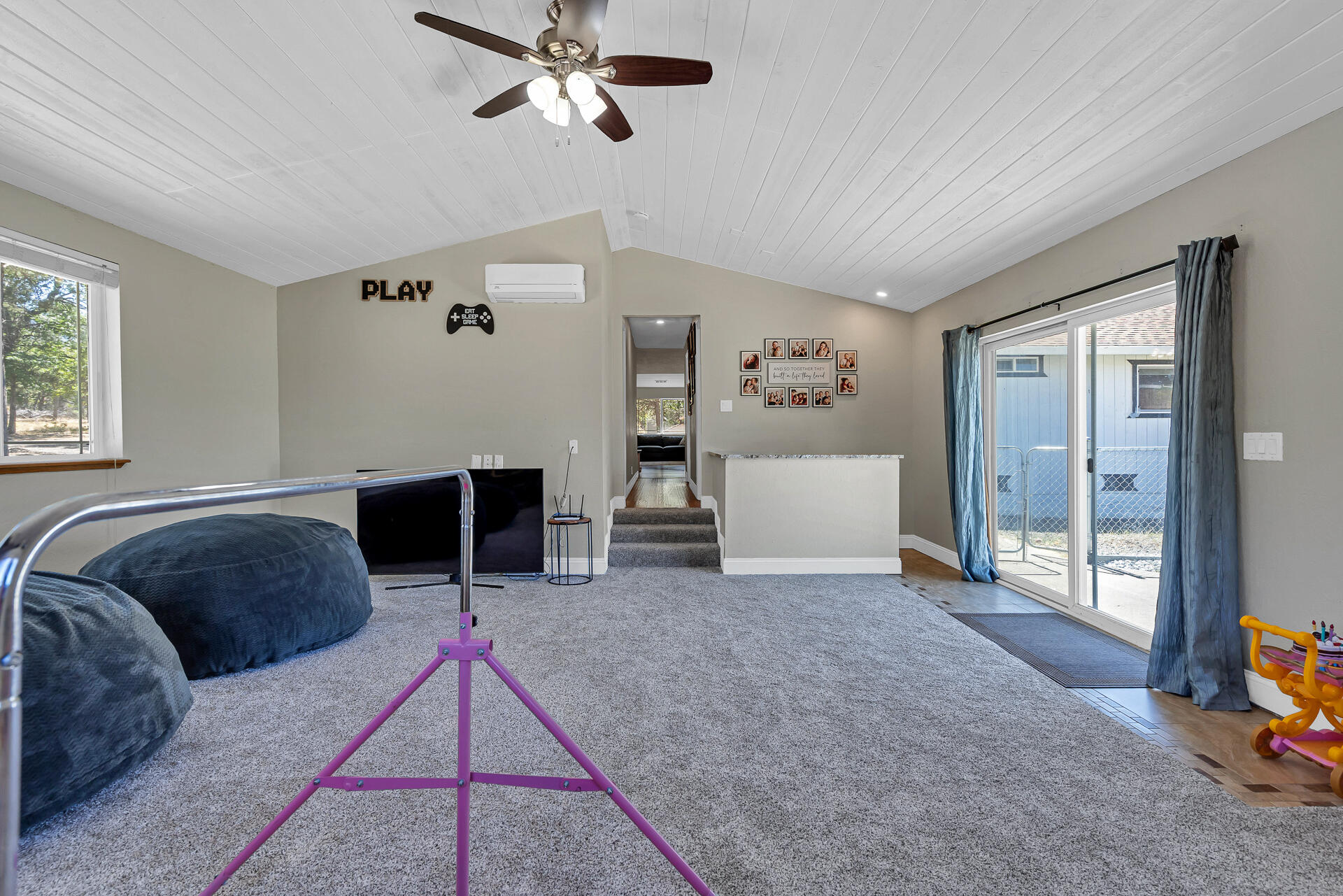 23570 Cassel Fall River Road Fall River Mills, CA 96028 - Photo 25 of 73 a living room with furniture and a fireplace
