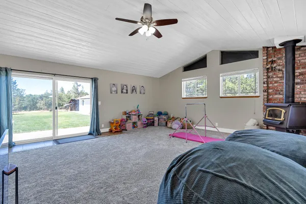a bed room with a bed and a chandelier