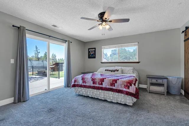 a bedroom with two beds and a window