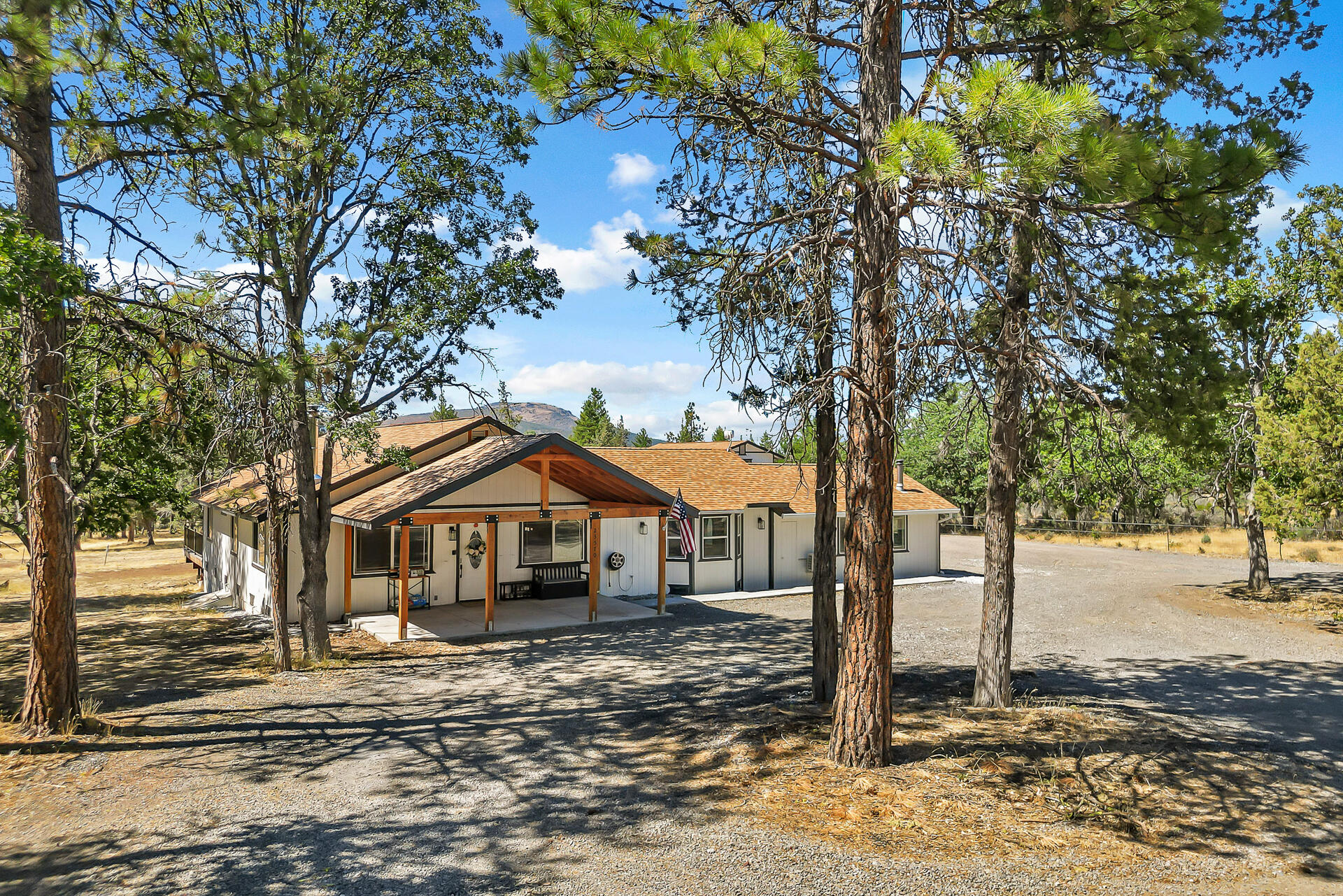23570 Cassel Fall River Road Fall River Mills, CA 96028 - Photo 3 of 73 a front view of a house with a yard