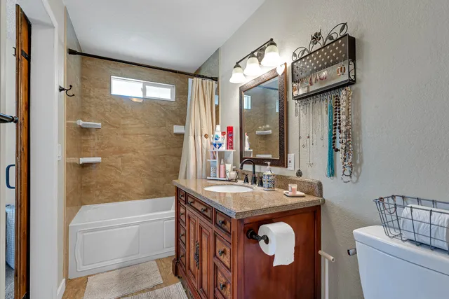 a view of a storage and utility room with closet dryer