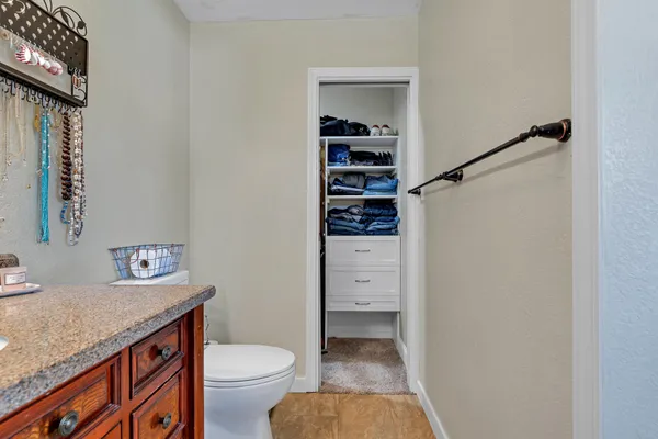 a bed room with a bed and a walk in closet